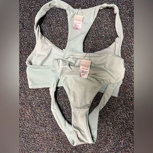 Small lspace ribbed Tara tie top and bottom. Gently used. No stains or pulls.